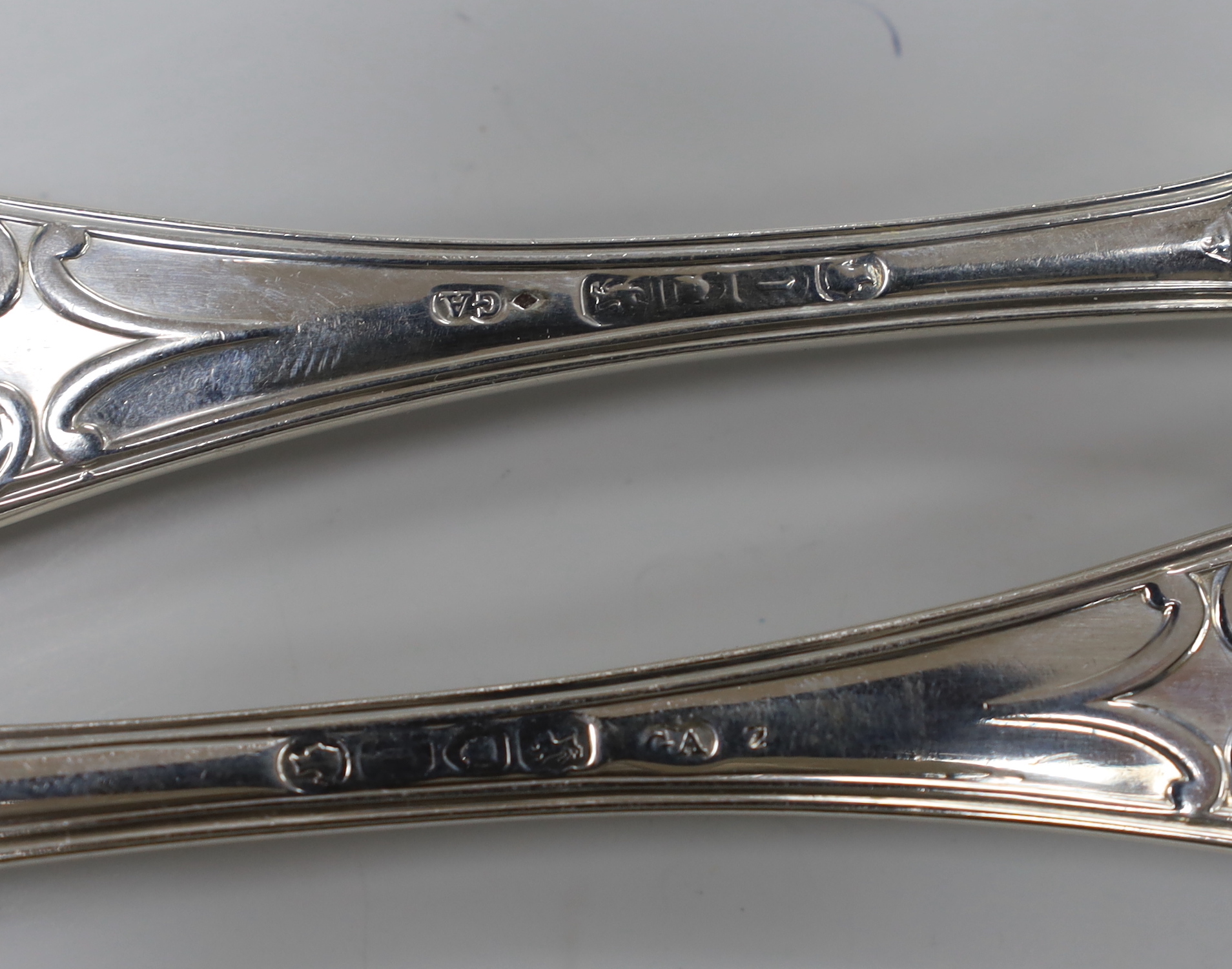 A Victorian part canteen of silver flatware by George Adams, comprising twelve table spoons, twelve table forks, twelve dessert forks, twelve dessert spoons, six sauce ladles and four condiment ladles, London, 1858